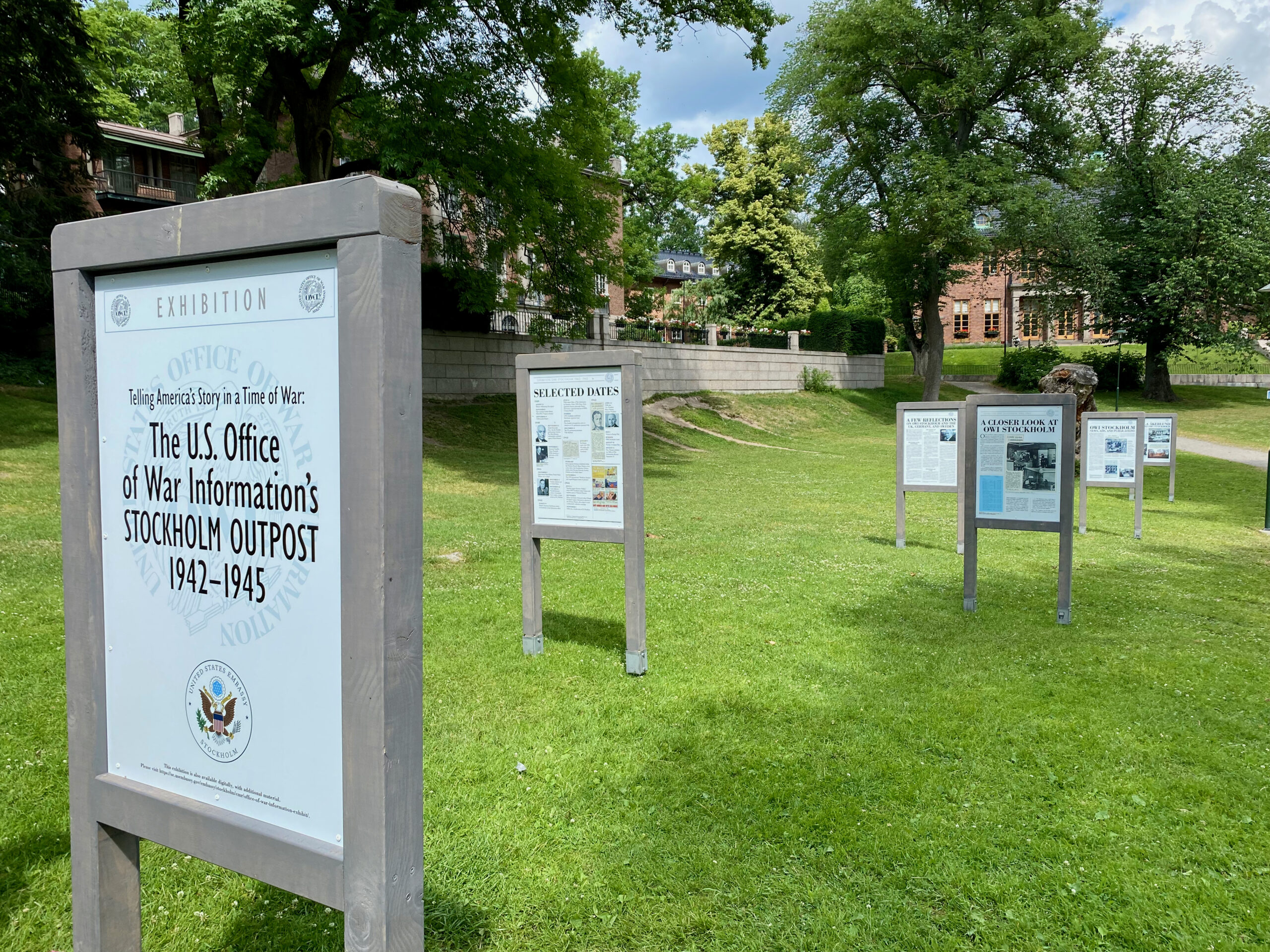Color photograph of double-sided display panels in a park