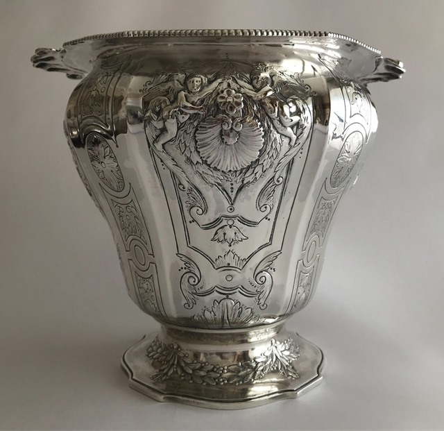 Color photograph, small footed vase in silver with engraving and embossed decoration