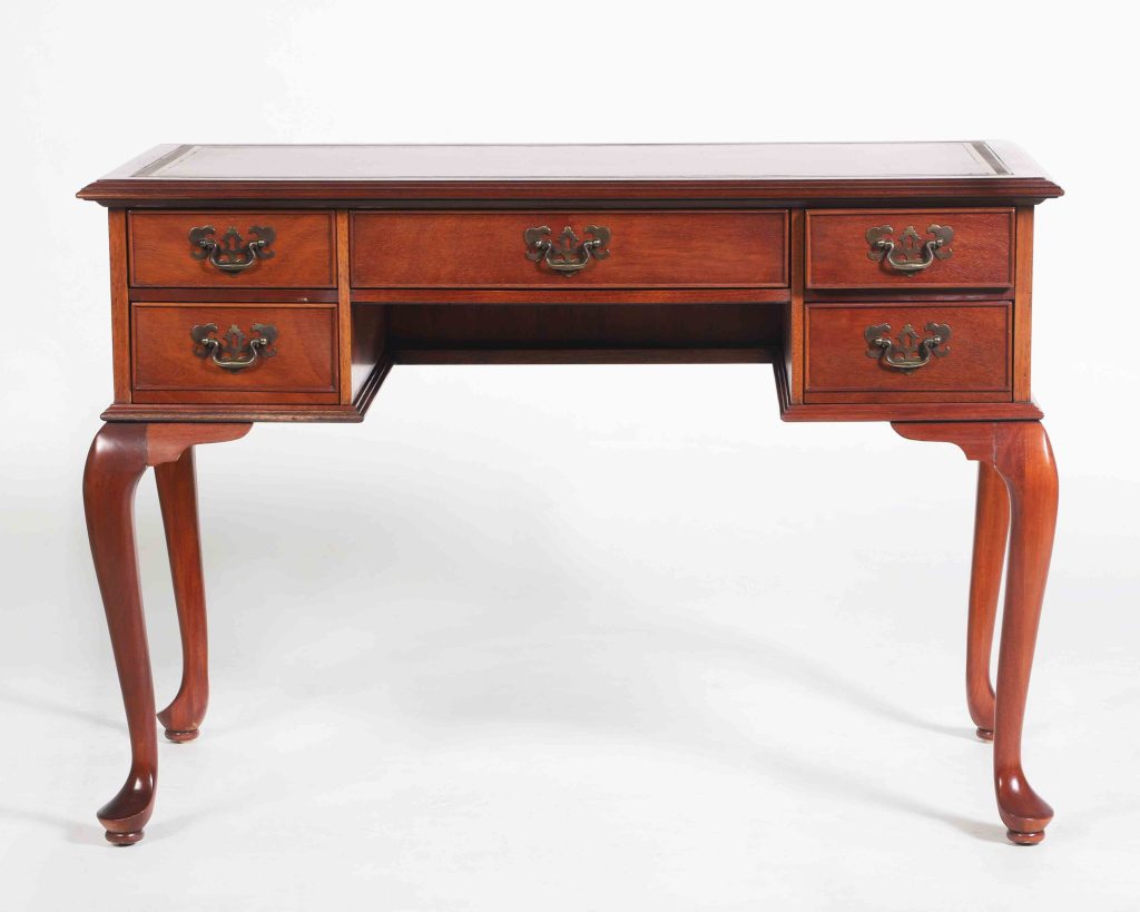 Cherry, circa early 20th century

U.S. Embassy Warsaw, Poland

The State Department’s Cultural Heritage collection features antique furniture of many styles and eras with influences from many places. This Queen Anne style desk, with its signature cabriole legs, is actually a high-quality reproduction from the early 20th century. As an early purchase for the ambassador’s residence, this desk has withstood roughly eighty years of use during the tenures of over twenty ambassadors at U.S. Embassy Warsaw.

While not a rare antique, the significance of this piece and many objects in the Department of State’s Cultural Heritage collection, lies in their provenance in relation to one or more US embassies around the world. Unlike most museums, the entirety of the Department of State’s heritage collection of art, artifacts and furniture is used as part of the daily functions of the embassy. Sometimes reproductions were purchased to furnish a newly acquired residence or were donated by an ambassador or local institution.
